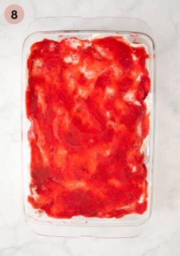adding strawberry puree on top of tiramisu in a dish.