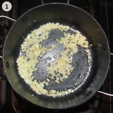 sauteing chopped onions to make soup with potatoes and wild garlic in a pot.