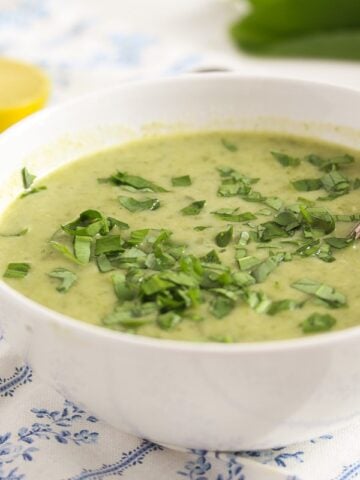 wild garlic and potato soup in a white bowl