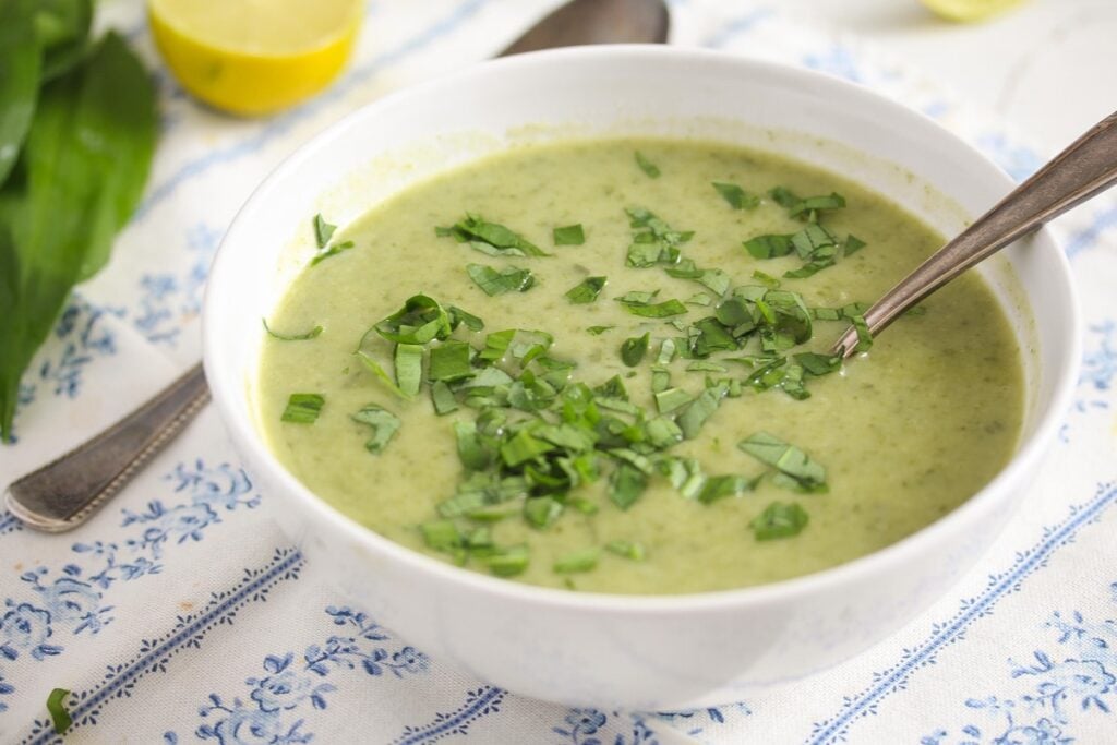 creamy soup with potatoes and greens