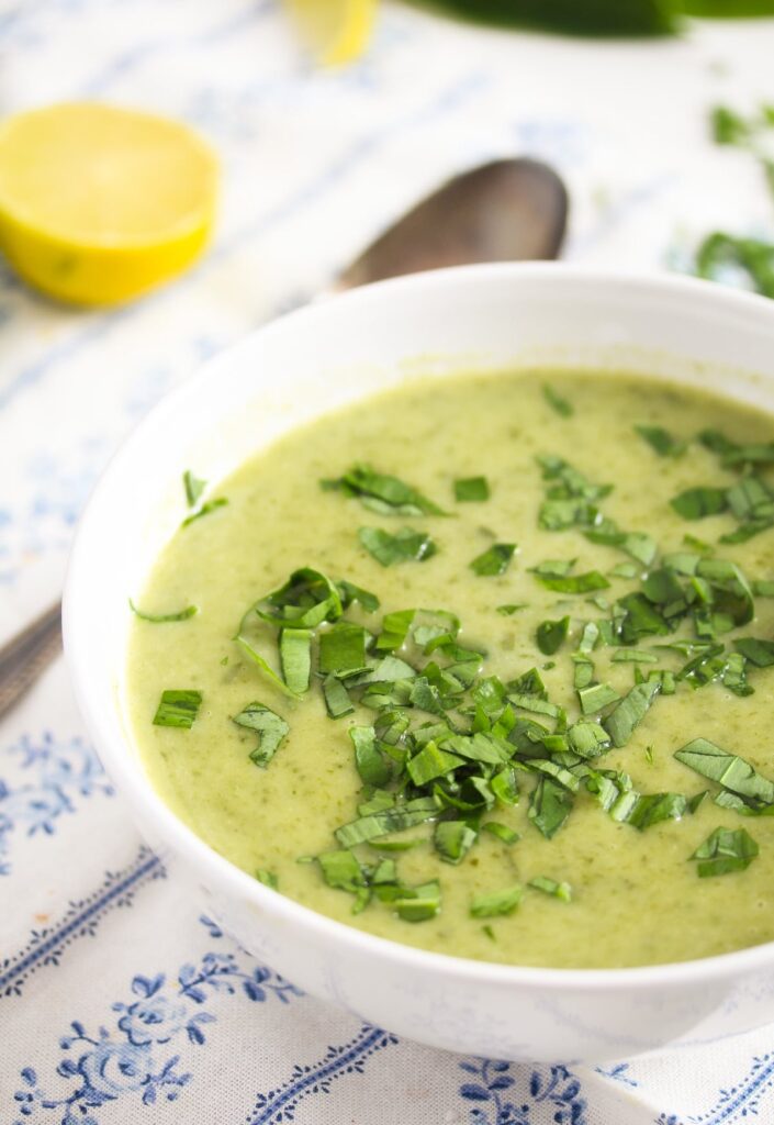 close up green soup decorated with wild garlic