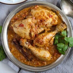 indian balti chicken with sauce and fresh cilantro in a small bowl.