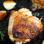 pinterest image with title for cast-iron chicken thighs.