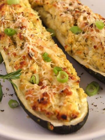 zucchini cottage cheese boats sprinkled with chopped green onions and ground black pepper.