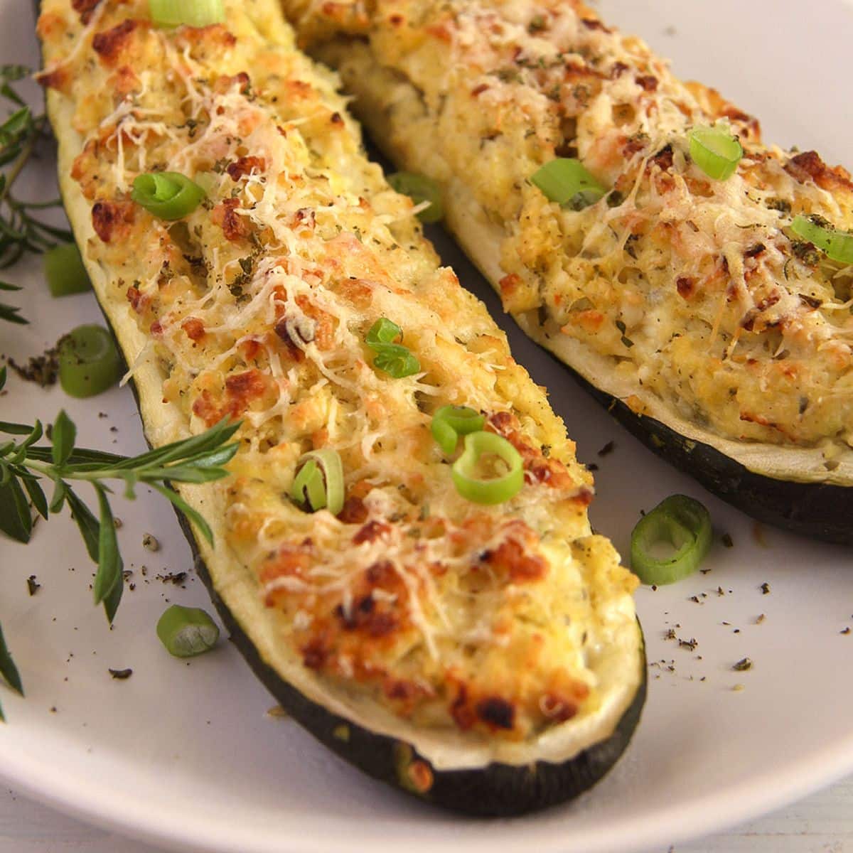 zucchini cottage cheese boats sprinkled with chopped green onions and ground black pepper.