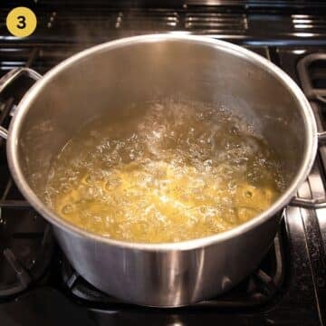 boiling elderflower syrup in a large pot.