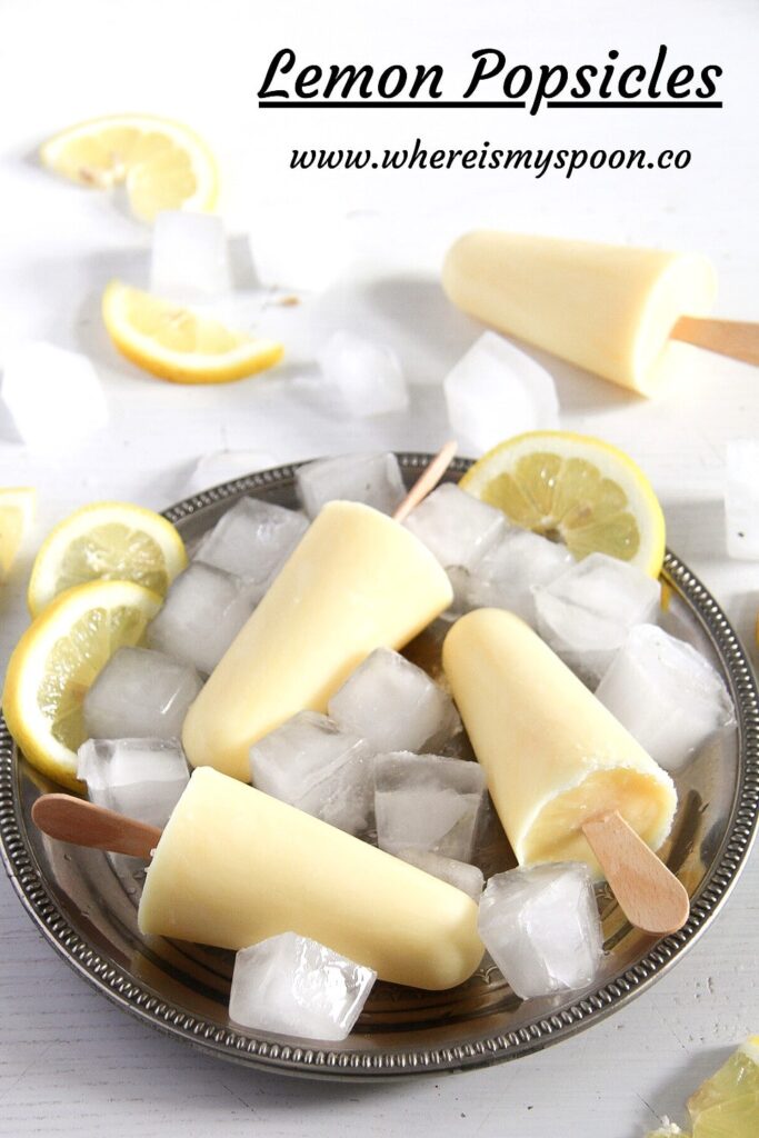silver plate with ice cubes, lemon and popsicles