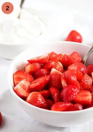 sugared strawberries steeping in a bowl.