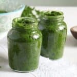 two small jars with preserved parsley paste.