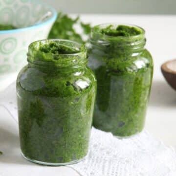 two small jars with preserved parsley paste.