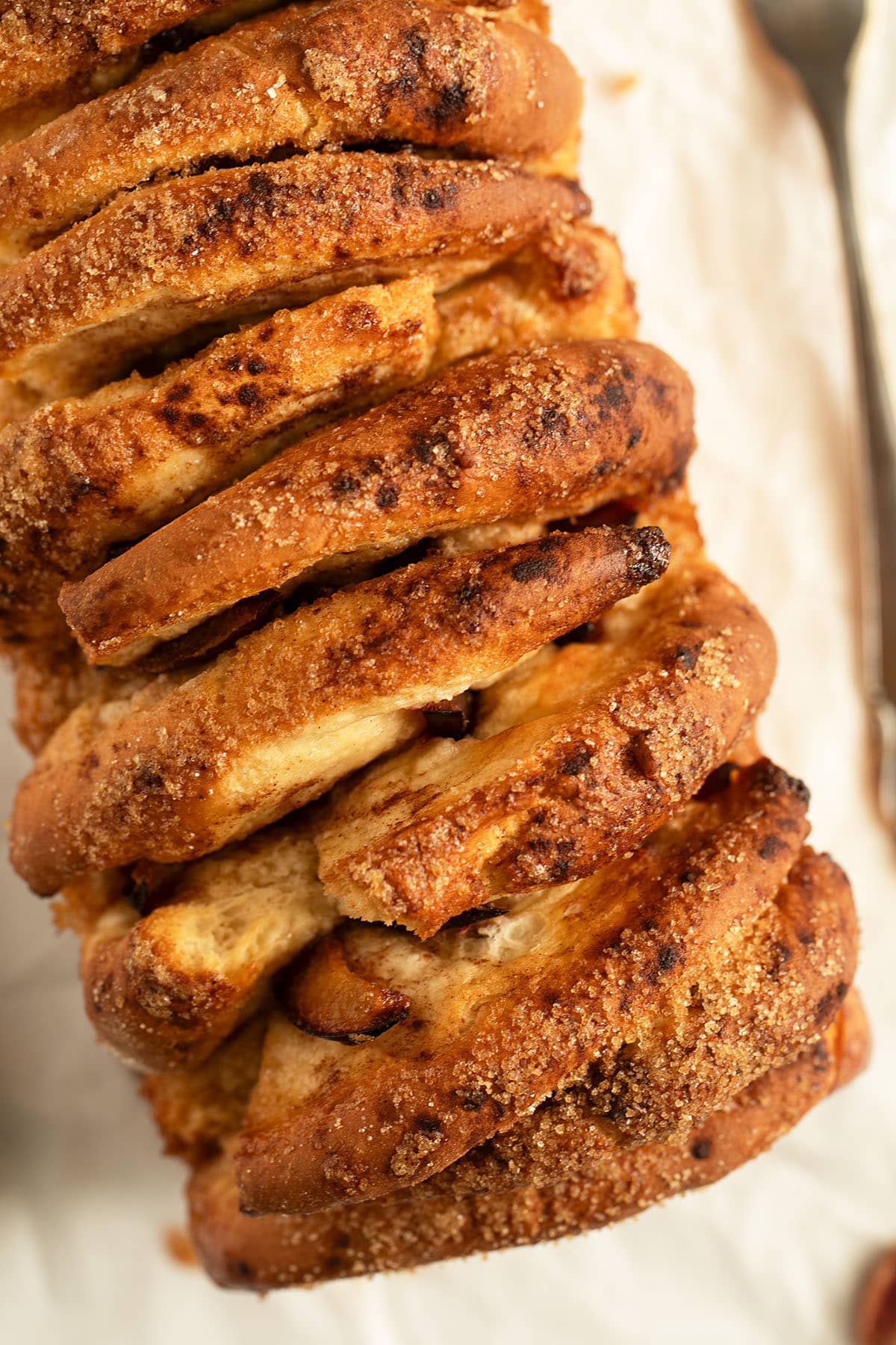 pull apart plum bread perfectly golden and crispy on the outside from the sugar.