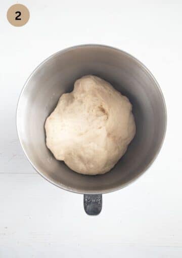 risen yeast dough for plum loaf in a bowl.