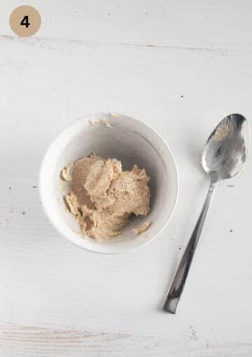 butter and brown sugar mixture in a small bowl and a spoon near it.