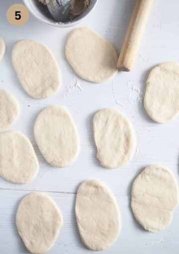 small ovals of dough for making pull apart bread and a small rolling pin.