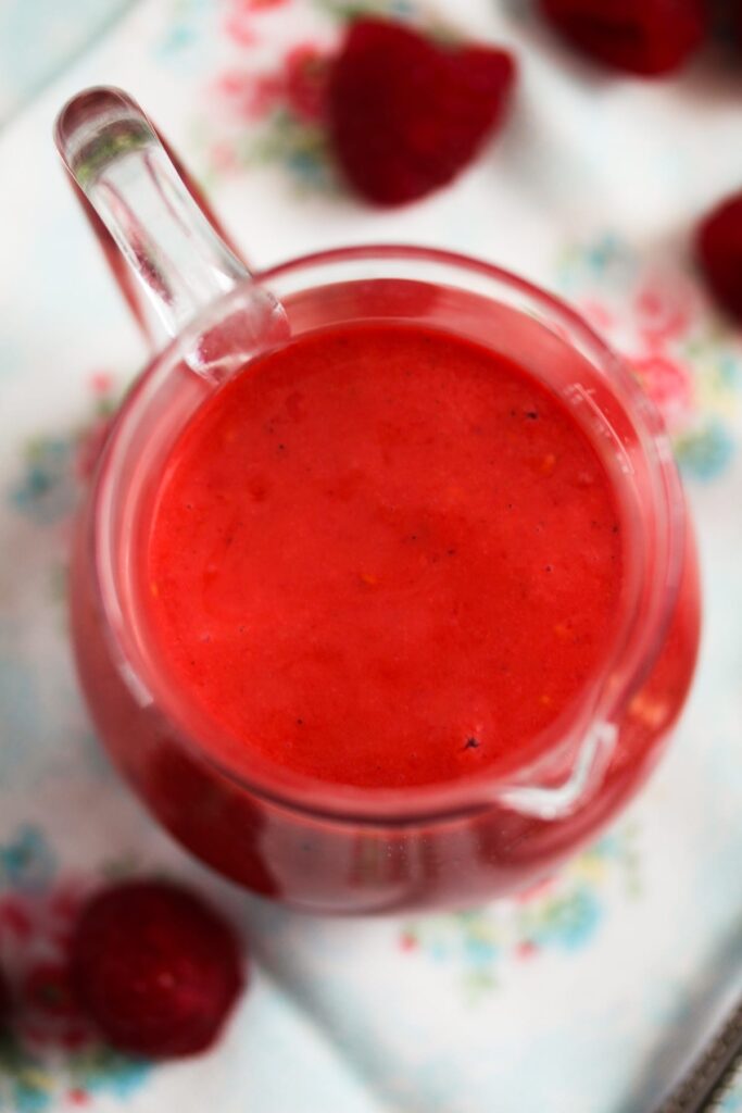 close up jug of red salad sauce