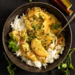 rhubarb chicken curry served with rice in a bowl.