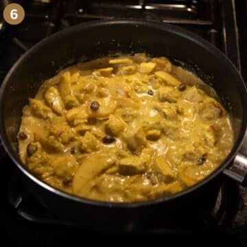 chicken and rhubarb curry simmering in a pot.