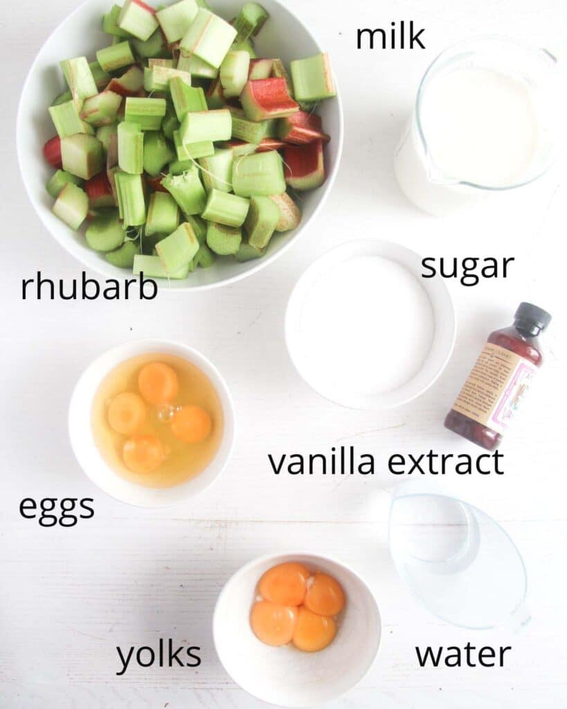 ingredients needed to make custard pudding with rhubarb arranged on a table.