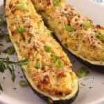 pin image with the title vegetarian zucchini boats.