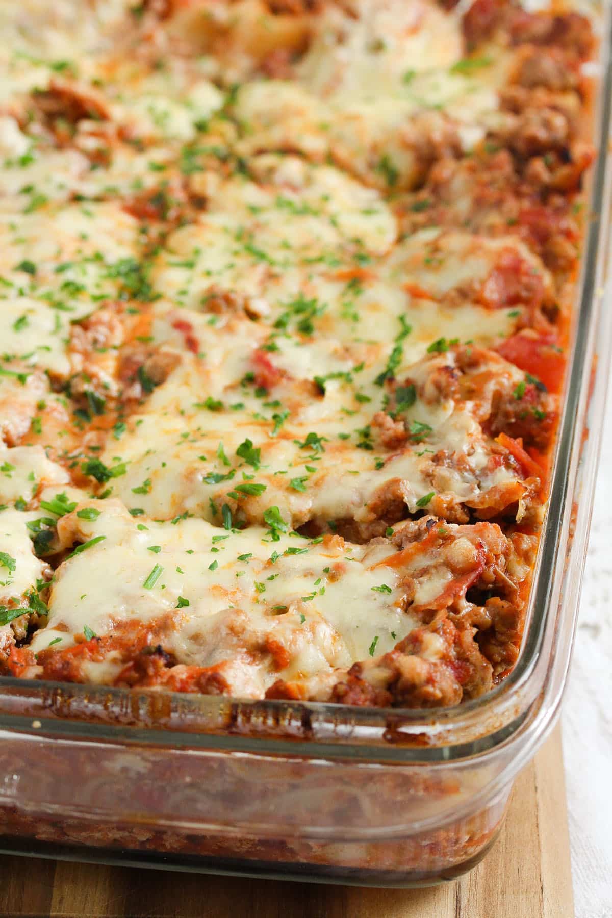 cheesy baked lasagna with yogurt cut into squares.