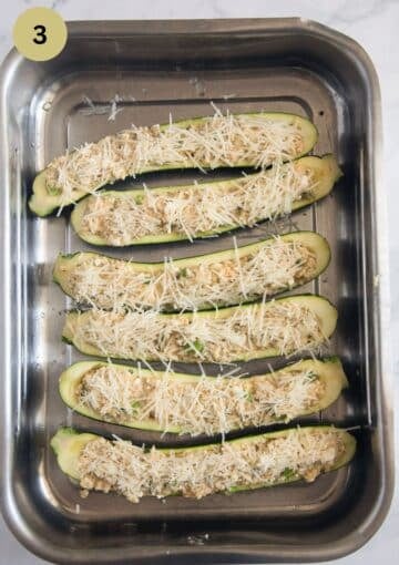 unbaked stuffed cottage cheese zucchini in a roasting pan.