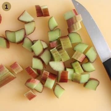 chopping rhubarb with a knife on a cutting board.