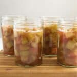 canned rhubarb in jar ready to be preserved in a water canner.