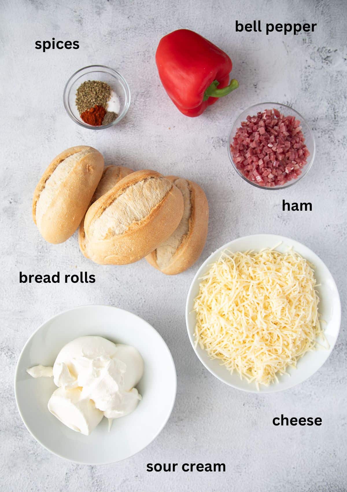 bread rolls, pepper, ham, cheese and sour cream for making baked rolls.