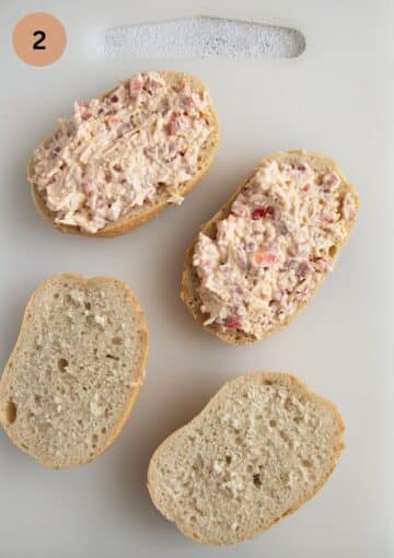 topping leftover bread rolls with a mixture of ham and cheese.