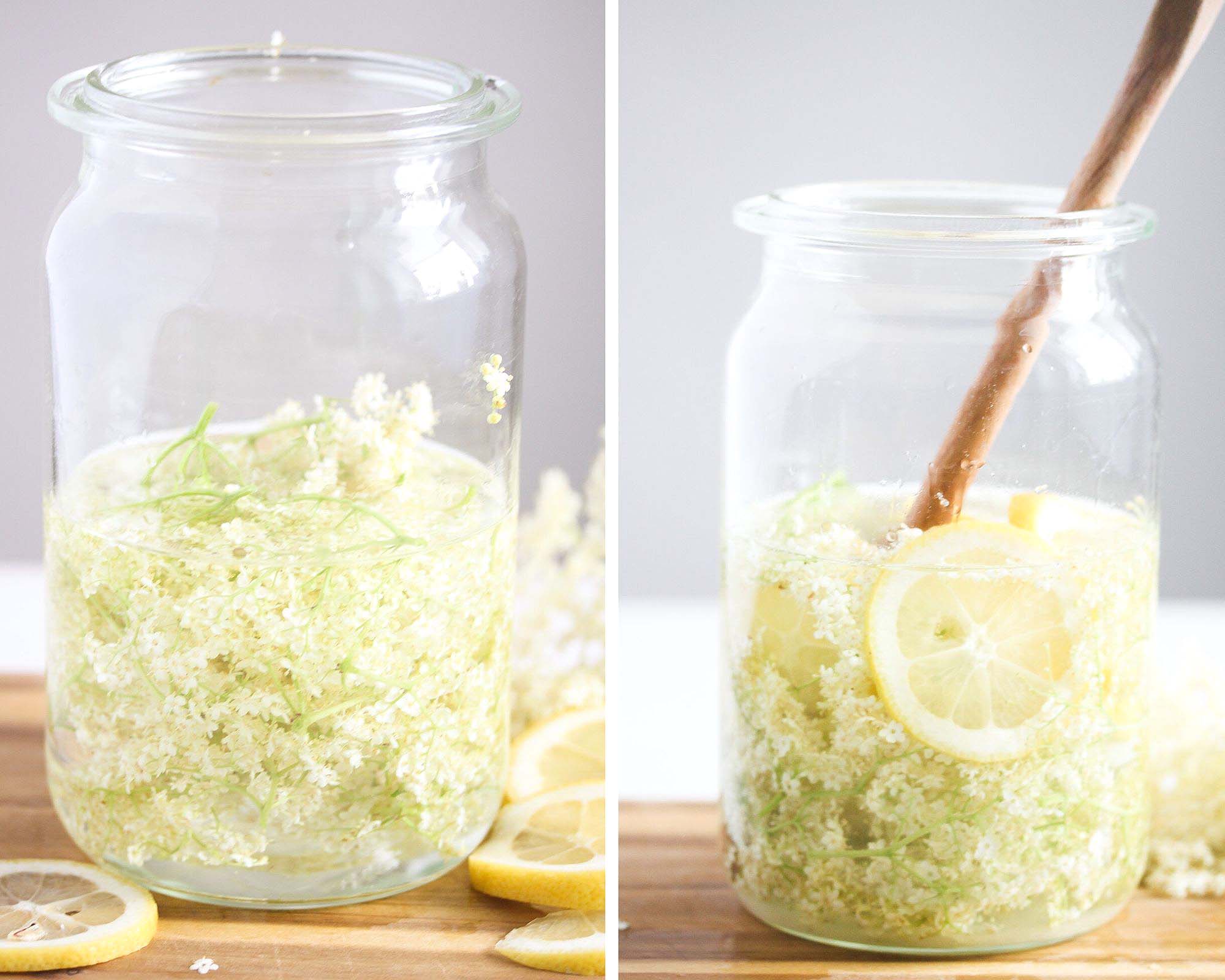 jars with elderflowers, lemon slices and alcohol