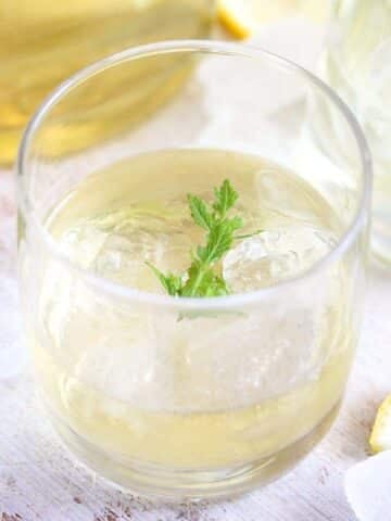 glass with elderflower gin on ice