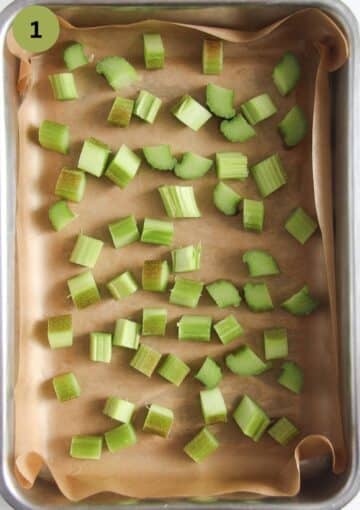 chopped rhubarb in a baking tin lined with parchment paper.