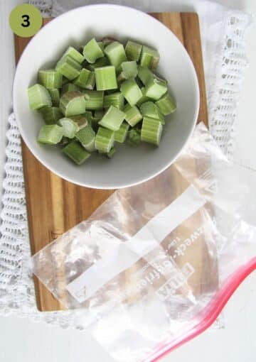 chopped rhubarb in a bowl and a freezer bag beside it.