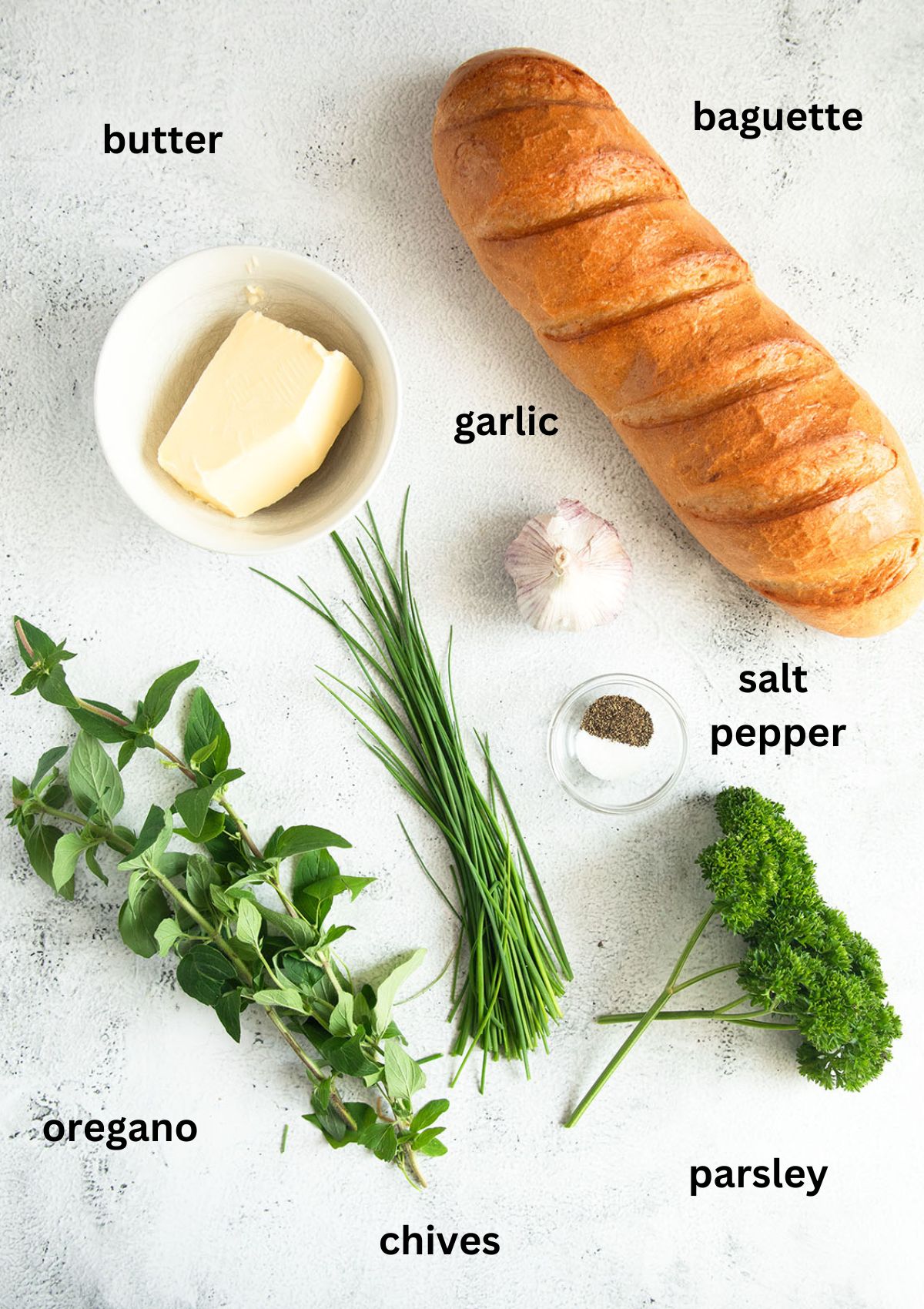 listed ingredients for stuffing baguette with garlic and herb butter.