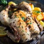 greek roasted chicken sprinkled with parsley and served with oven potatoes.