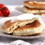 romanian placinte cu varza served with a dollop of sour cream.