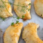 pinterest image with the title spicy beef empanadas.