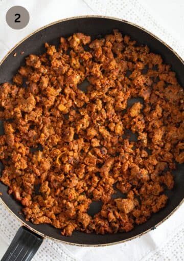 cooked beef filling for empanadas in a skillet.