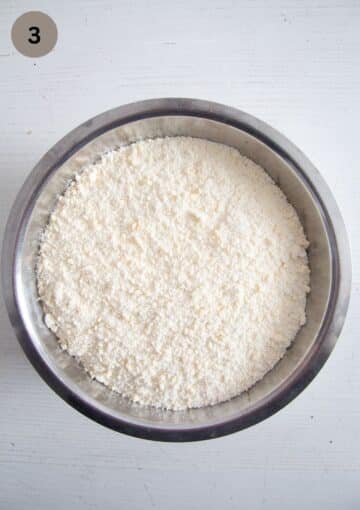 mixed flour and butter in a bowl for making empanada dough.