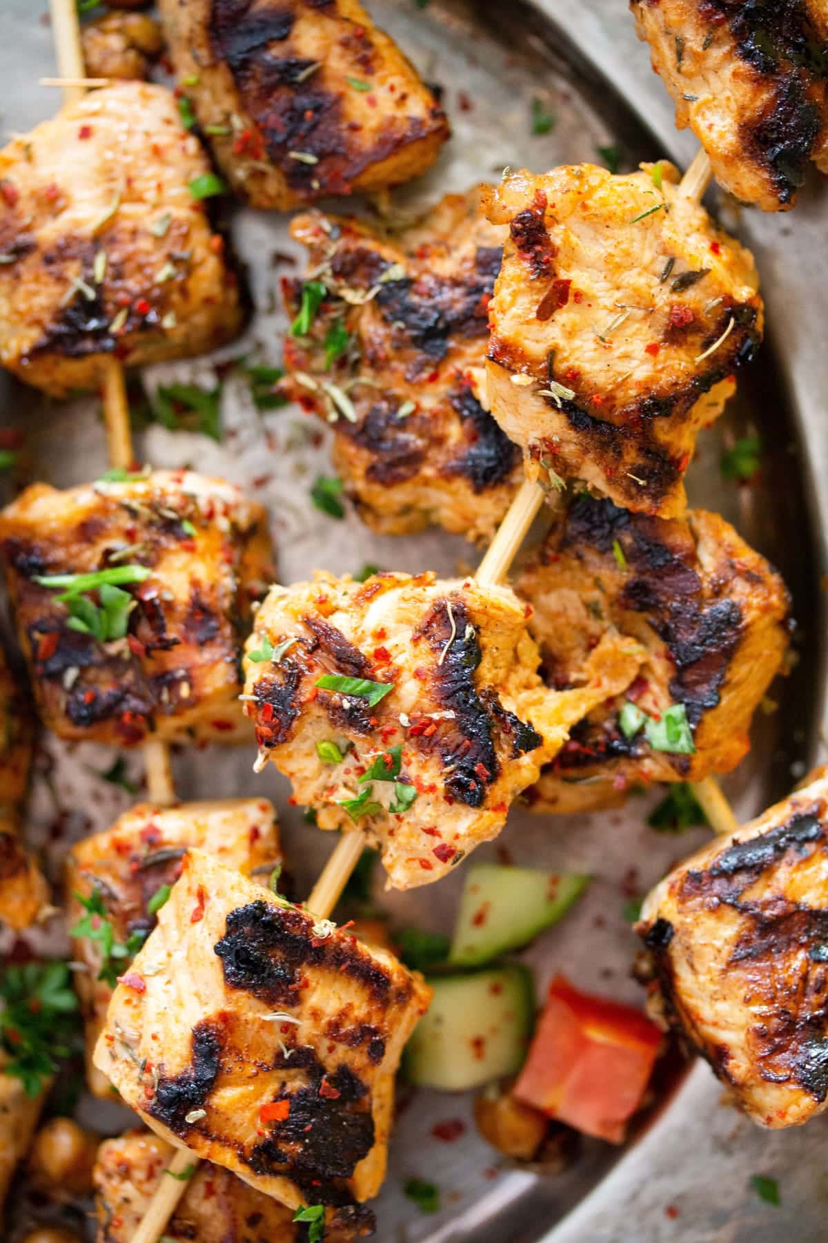 close up of skewers with nicely charred turkey cubes.