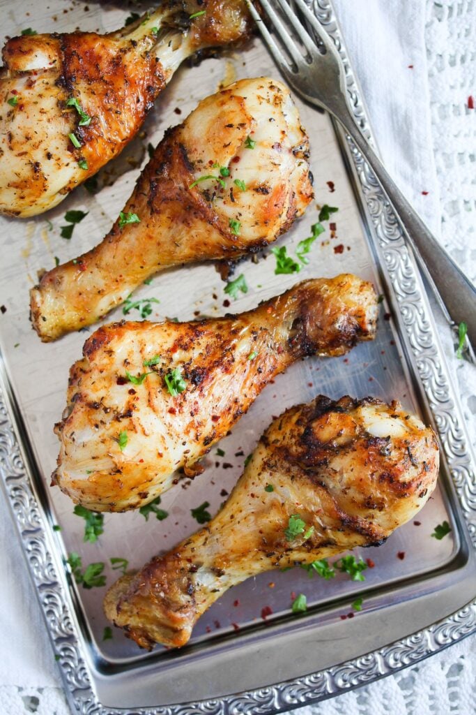 air fried drumsticks on a silver platter seen from above