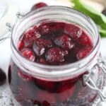pinterest image with the title amaretto cherries.