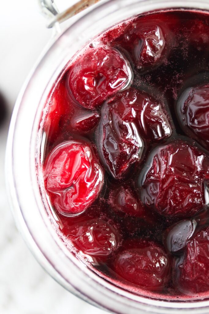 boozy cherries glossy and shiny in a jar