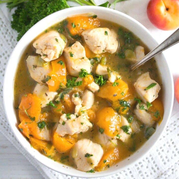 dish with chicken breast and apricots overhead view.
