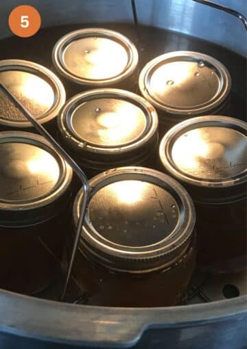 canning jars of jam in a water bath canner.