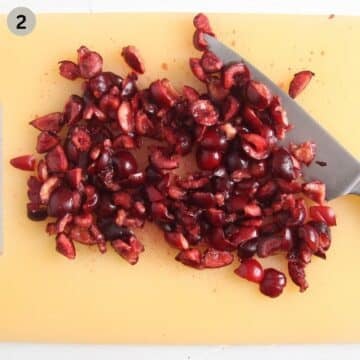 chopping cherries with a chef's knife.