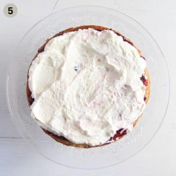 filling bakewell cake with whipped cream.
