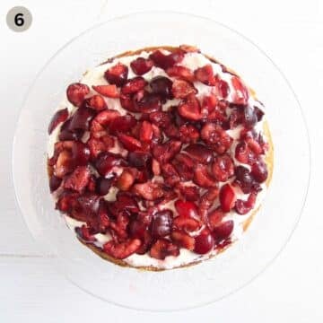 filling bakewell cake with chopped fresh cherries.