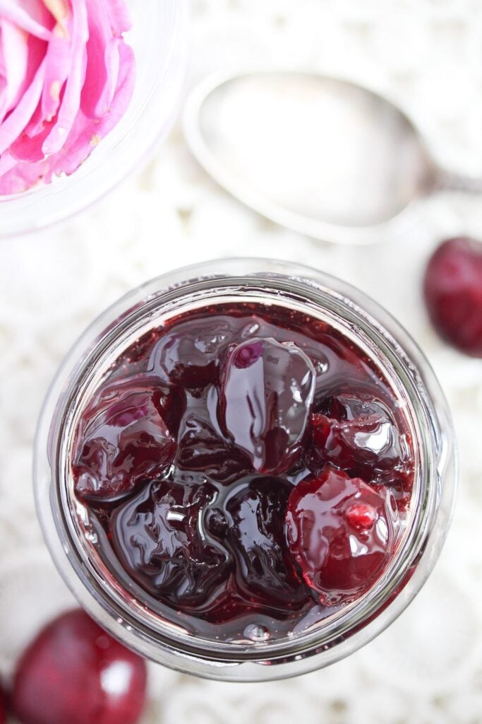 candied cherries in a jar seen from above