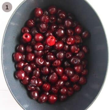 uncooked cherries in an oval dutch oven.